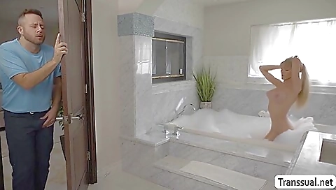 A blonde babe has an attractive ass and a big cock