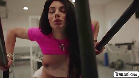 Big-titted brunette in a black blazer and stockings in the water